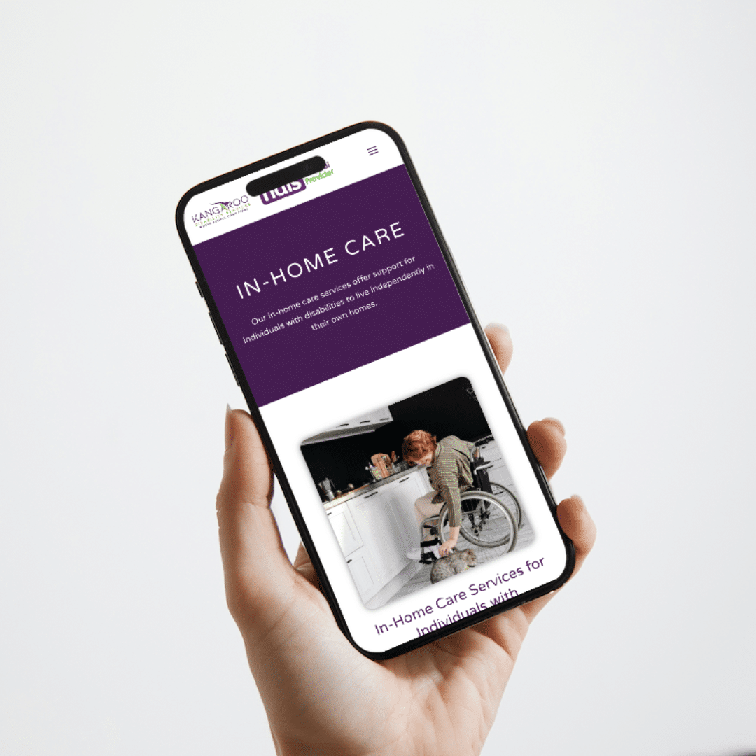 A mobile phone displaying a purple NDIS website