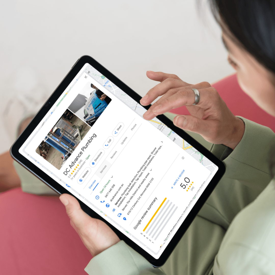 A woman is using an ipad to look at a property listing on Google Business Profile.